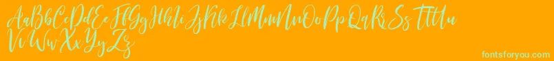 Michelles free-Schriftart – Grüne Schriften auf orangefarbenem Hintergrund