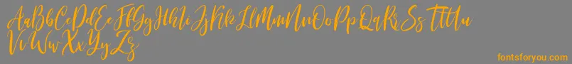Saiba mais sobre a fonte Michelles free Fonte Michelles free – fontes laranjas em um fundo cinza