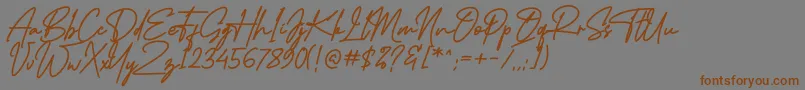 フォントMidlestoneSignature – 茶色の文字が灰色の背景にあります。