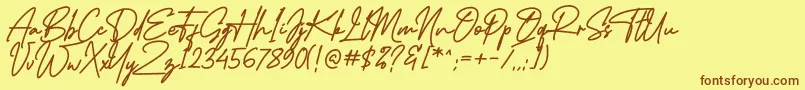 フォントMidlestoneSignature – 茶色の文字が黄色の背景にあります。