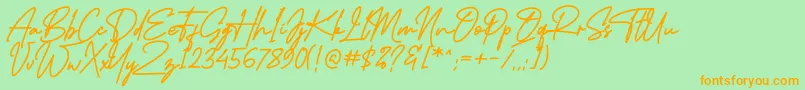 フォントMidlestoneSignature – オレンジの文字が緑の背景にあります。
