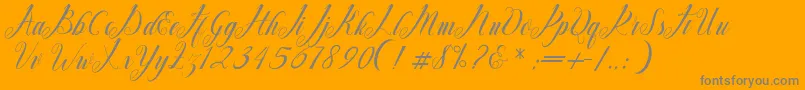 Mighty Free-Schriftart – Graue Schriften auf orangefarbenem Hintergrund