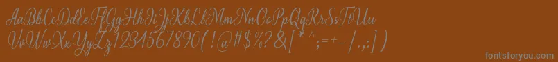 Czcionka Milgun Font by 7NTypes – szare czcionki na brązowym tle