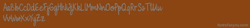 Police Milky Cookies Script Demo – polices grises sur fond brun