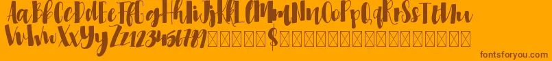 Millicious-Schriftart – Braune Schriften auf orangefarbenem Hintergrund