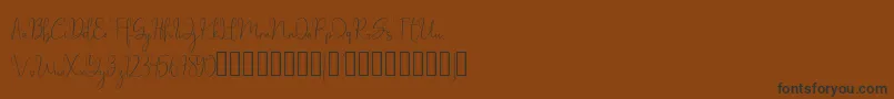 millow-fontti – mustat fontit ruskealla taustalla