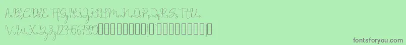 millow-fontti – harmaat kirjasimet vihreällä taustalla