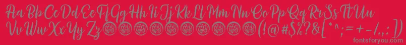 Millythea Font by 7NTypes D-fontti – harmaat kirjasimet punaisella taustalla