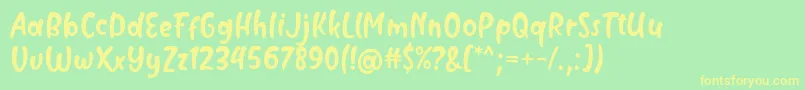 Milyone Font by Rifky 7NTypes Font – Yellow Fonts on Green Background