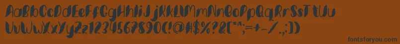Minkem font by 7NTypes D Font – Black Fonts on Brown Background