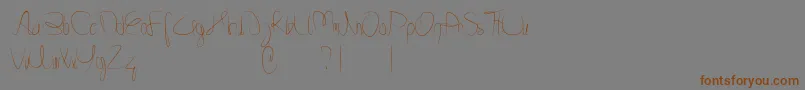 Minnesottafree Font – Brown Fonts on Gray Background
