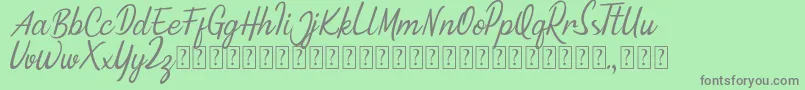 Fonte Minnie Queen Font – fontes cinzas em um fundo verde