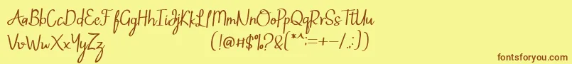 フォントMintlic – 茶色の文字が黄色の背景にあります。