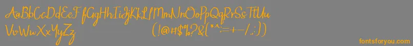 フォントMintlic – オレンジの文字は灰色の背景にあります。