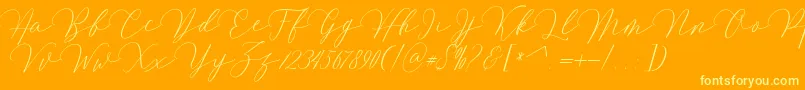 Mirrabella-Schriftart – Gelbe Schriften auf orangefarbenem Hintergrund