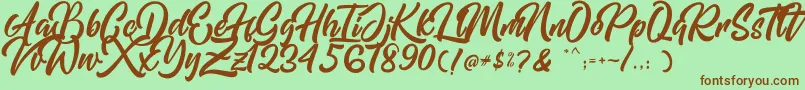 Mishaland Font – Brown Fonts on Green Background