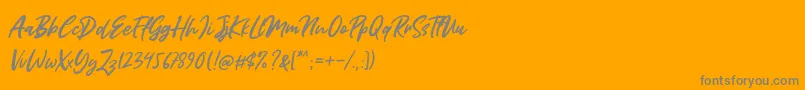 Miss Rhinetta-Schriftart – Graue Schriften auf orangefarbenem Hintergrund