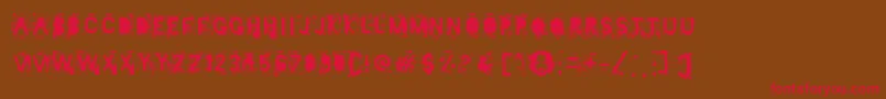 フォントMister Manson – 赤い文字が茶色の背景にあります。