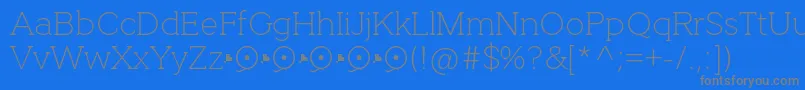 フォントQuotusThin – 青い背景に灰色の文字