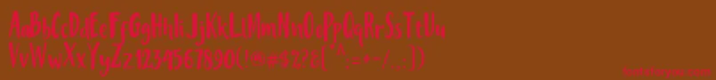 フォントMisteryFont – 赤い文字が茶色の背景にあります。