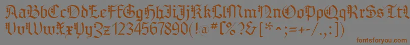 フォントMKBrokenTypes – 茶色の文字が灰色の背景にあります。