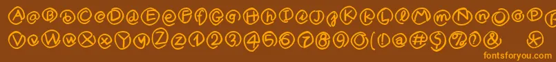 MKlammerAffen-Schriftart – Orangefarbene Schriften auf braunem Hintergrund