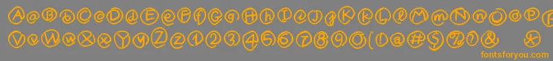 フォントMKlammerAffen – オレンジの文字は灰色の背景にあります。
