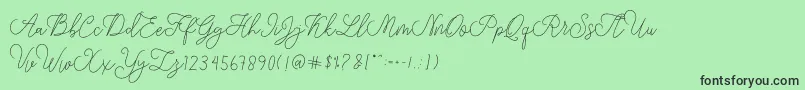 フォントmodista script – 緑の背景に黒い文字