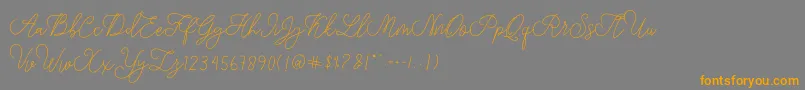フォントmodista script – オレンジの文字は灰色の背景にあります。