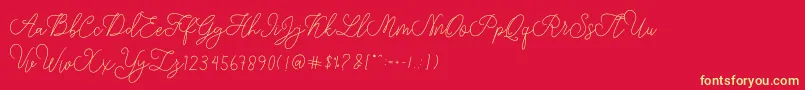 Fonte modista script – fontes amarelas em um fundo vermelho