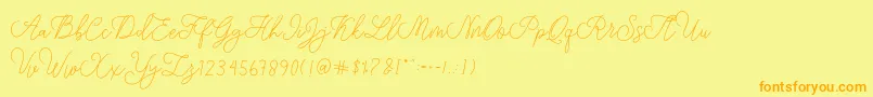 Fonte modista script – fontes laranjas em um fundo amarelo