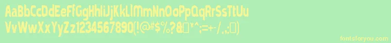 フォントmold papa – 黄色の文字が緑の背景にあります