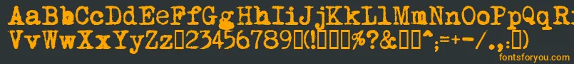 フォントMomРѕt    – 黒い背景にオレンジの文字