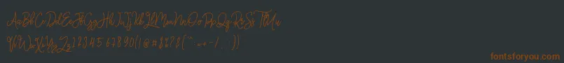 Fonte Monalisa Monoline Script – fontes marrons em um fundo preto