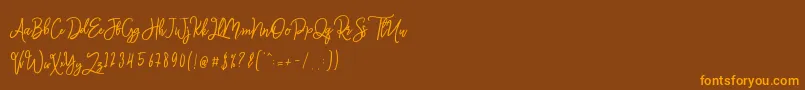 Monalisa Script-Schriftart – Orangefarbene Schriften auf braunem Hintergrund