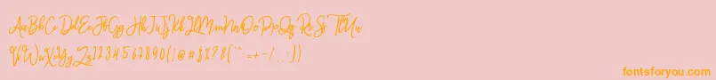 フォントMonalisa Script – オレンジの文字がピンクの背景にあります。