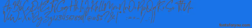 Monatta-Schriftart – Braune Schriften auf blauem Hintergrund