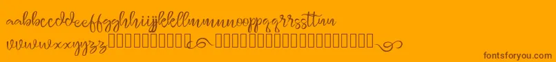 monggolah-Schriftart – Braune Schriften auf orangefarbenem Hintergrund