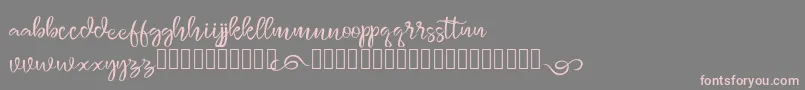 monggolah-Schriftart – Rosa Schriften auf grauem Hintergrund