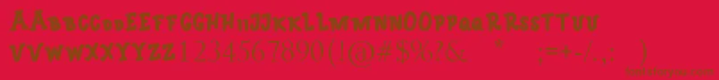 monica-Schriftart – Braune Schriften auf rotem Hintergrund