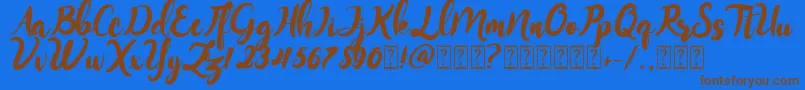 Monitta Font – Brown Fonts on Blue Background