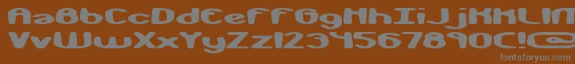 monkphon-fontti – harmaat kirjasimet ruskealla taustalla
