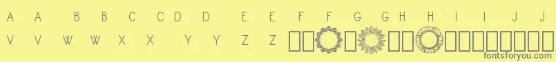 Шрифт Monogram Framer Demo – серые шрифты на жёлтом фоне