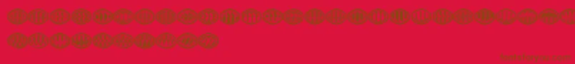 Czcionka Monogramus – brązowe czcionki na czerwonym tle