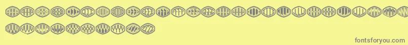 Czcionka Monogramus – szare czcionki na żółtym tle