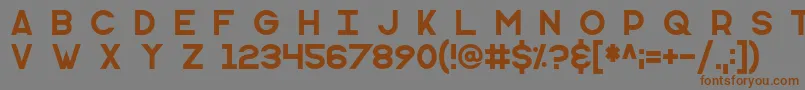 フォントMonometric – 茶色の文字が灰色の背景にあります。