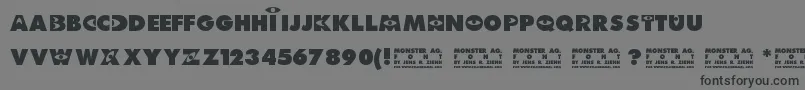 フォントMonster AG – 黒い文字の灰色の背景