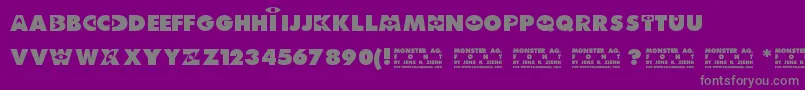 Monster AG-Schriftart – Graue Schriften auf violettem Hintergrund