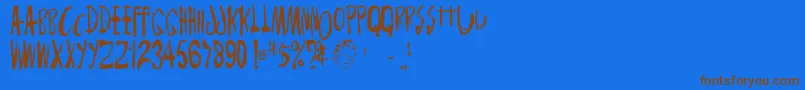 Monsterchild Font – Brown Fonts on Blue Background