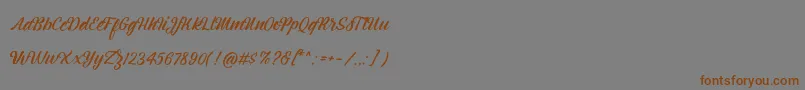 Montagne Script Free Demo-Schriftart – Braune Schriften auf grauem Hintergrund